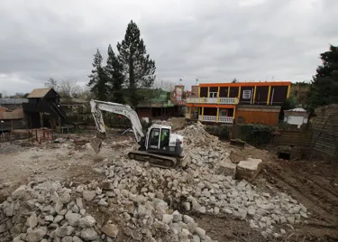 March construction update for PAW Patrol at Chessington: digger with piles of rubble demolishing old Mexicana buildings