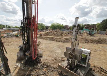 June update for the PAW Patrol Construction Diary at Chessington: two machines excavating for building foundations and crushing material during demolition