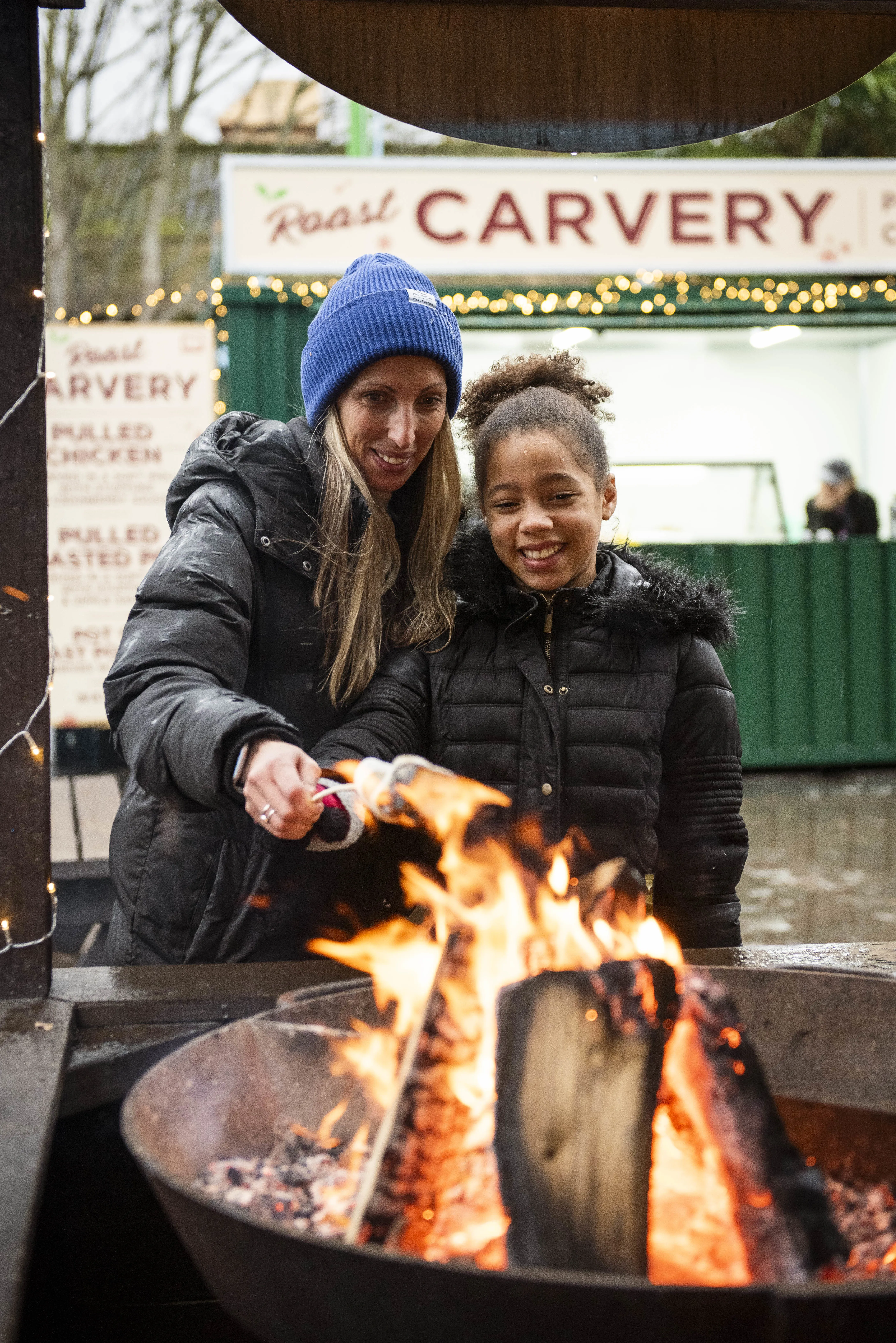 Mum And Daughter Roasting Marshmallows