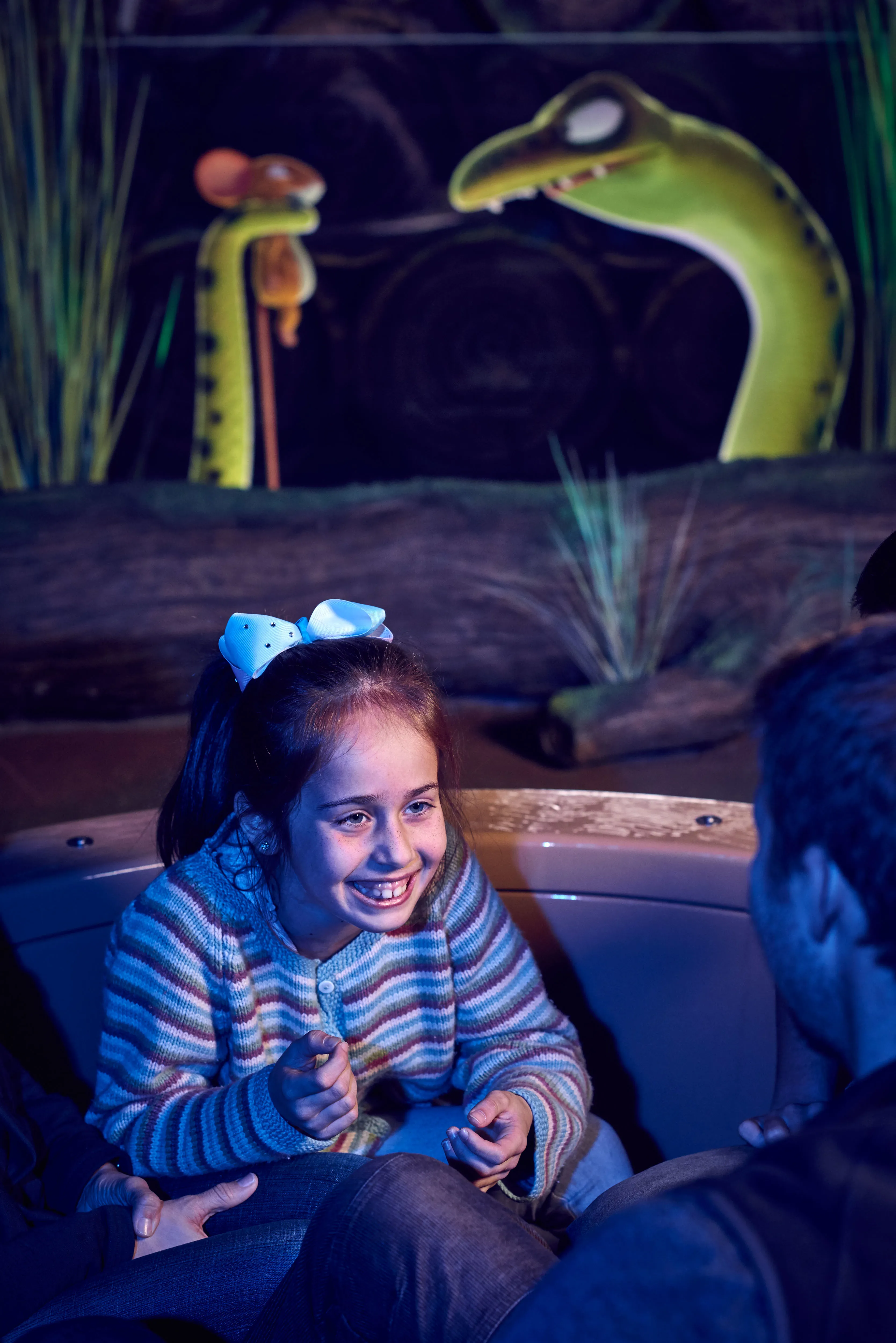 Girl smiling at parents on The Gruffalo River Ride Adventure