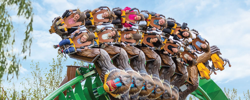 People on Mandrill Mayhem roller coaster at Chessington World of Adventures Resort