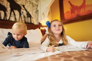Children colouring in a book in the Giraffe Room at Chessington World of Adventures Resort