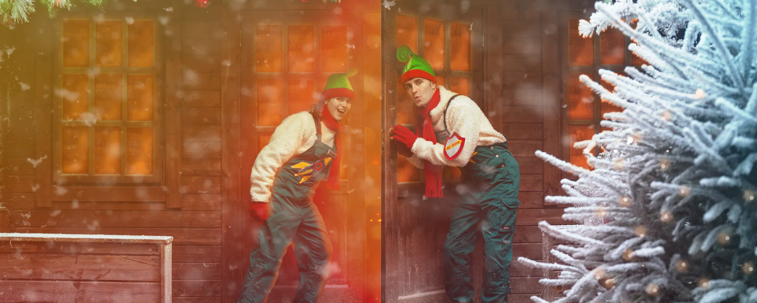 Chessington Christmas Elves opening the doors to Santa's Grotto